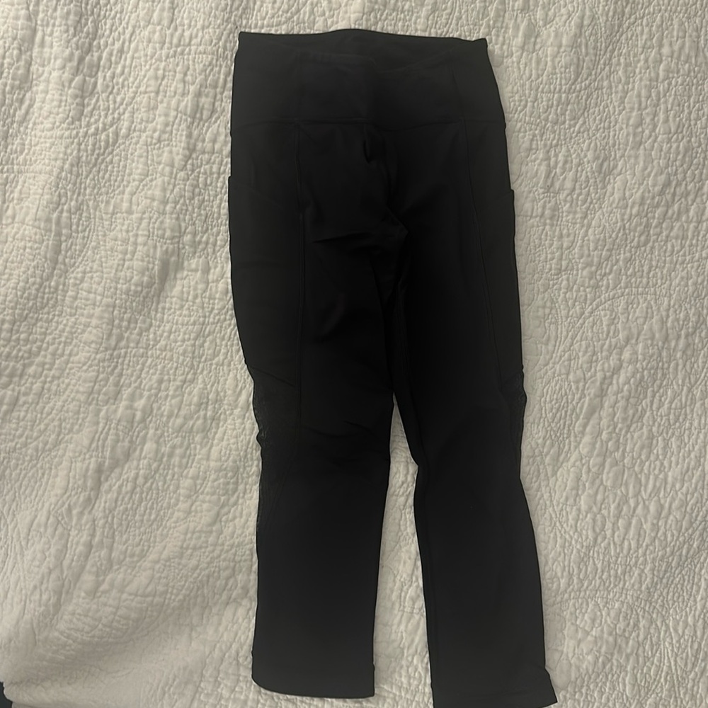 Lululemon black capris with see-thru polka dot. Size 6